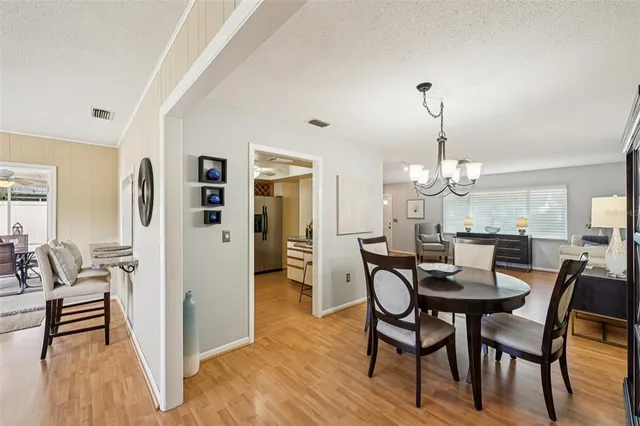 a kitchen with stainless steel appliances kitchen island granite countertop a sink and cabinets