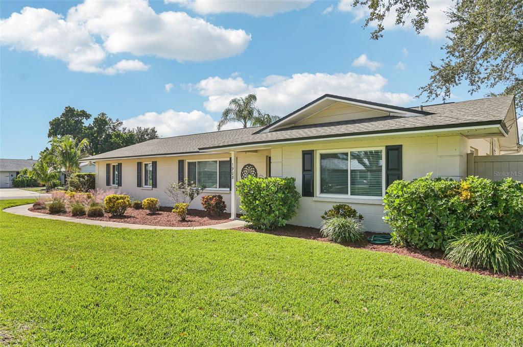 1908 49th Street West Bradenton, FL 34209 - Photo 2 of 57 a front view of house with yard and green space