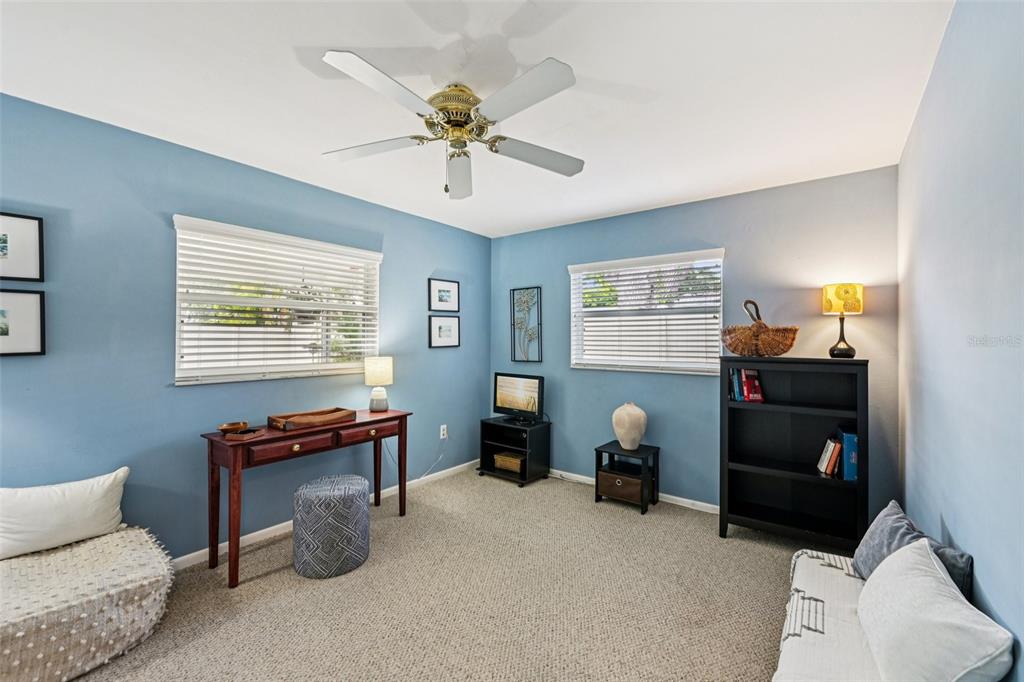 1908 49th Street West Bradenton, FL 34209 - Photo 28 of 57 a bedroom with furniture and a window