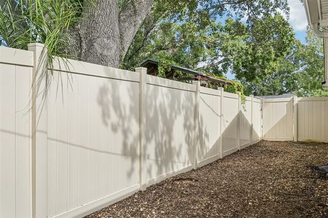 an aerial view of residential houses with outdoor space and street view