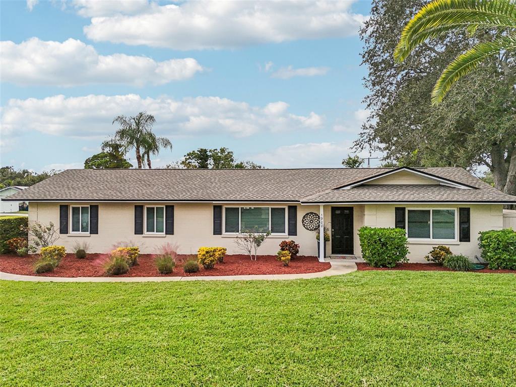 1908 49th Street West Bradenton, FL 34209 - Photo 41 of 57 a front view of house with yard and green space
