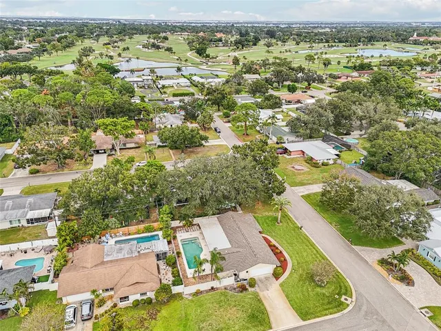 an aerial view of residential building and lake