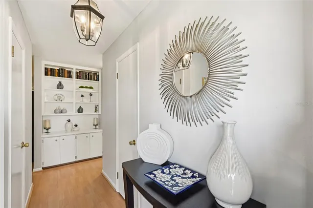 a bedroom with furniture and wooden floor