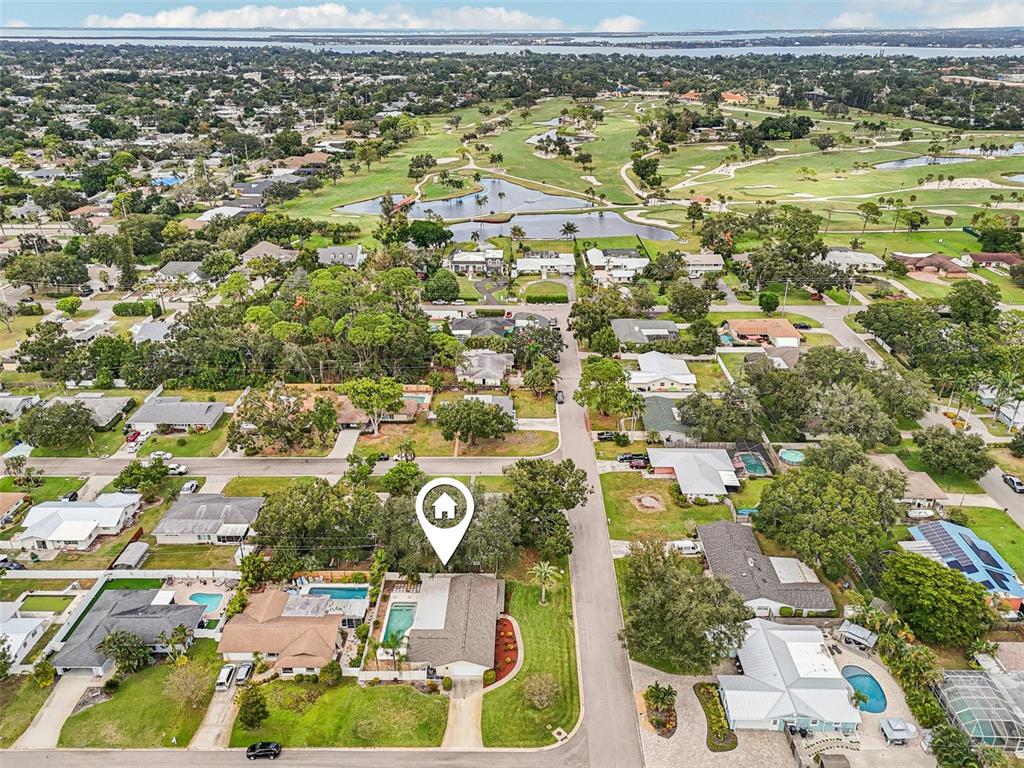 1908 49th Street West Bradenton, FL 34209 - Photo 52 of 57 an aerial view of residential houses with outdoor space and trees