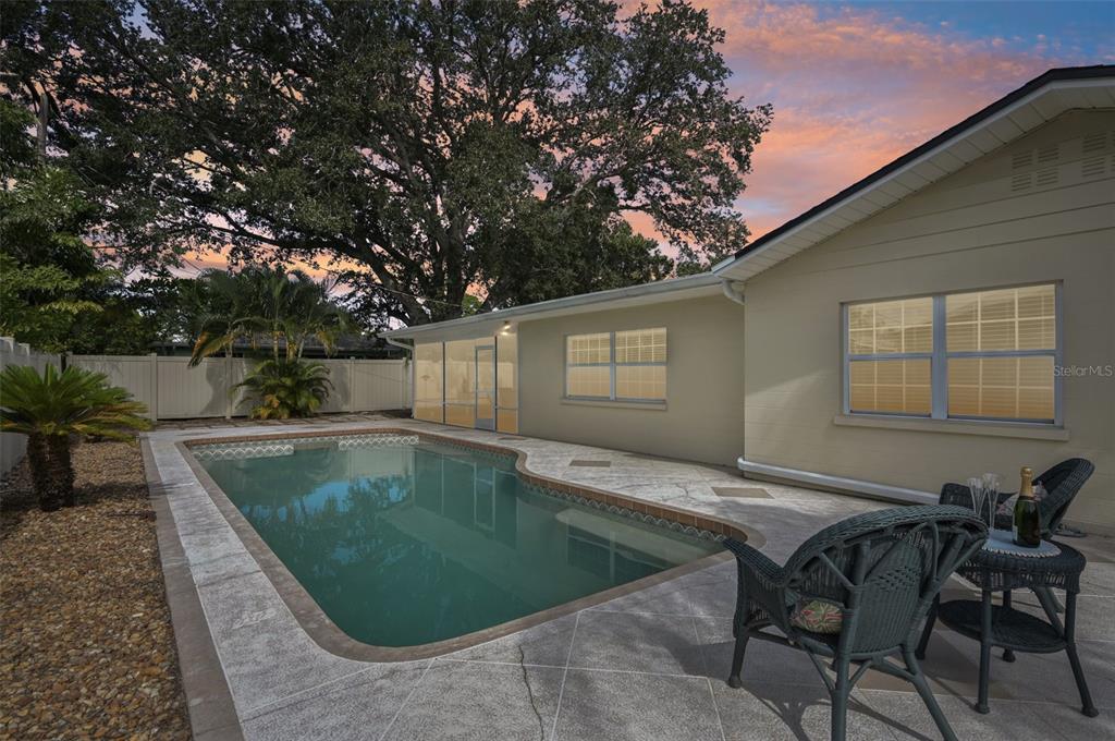 1908 49th Street West Bradenton, FL 34209 - Photo 57 of 57 a view of a swimming pool with a lounge chairs