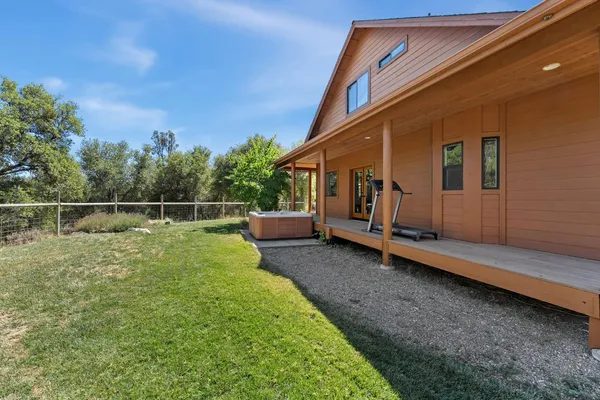 a view of a backyard of the house