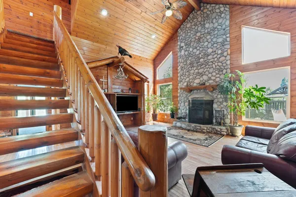 a view of living room with furniture fireplace and a flat screen tv