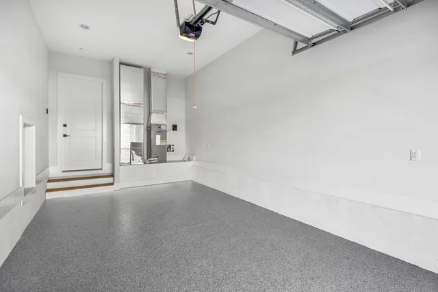 an empty room with a empty space and windows