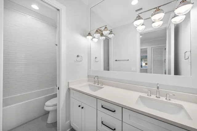 a bathroom with a bathtub and a toilet