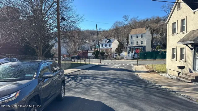 a view of a street with houses