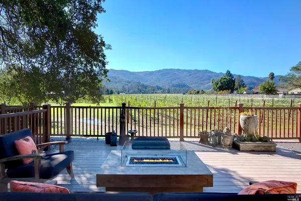 a view of a patio with wooden floor