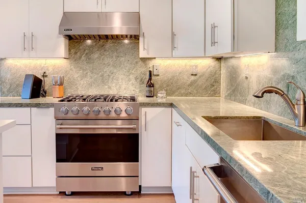 a kitchen with a stove and a sink