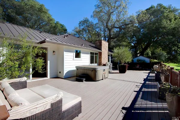 a view of a patio with couches and potted plants