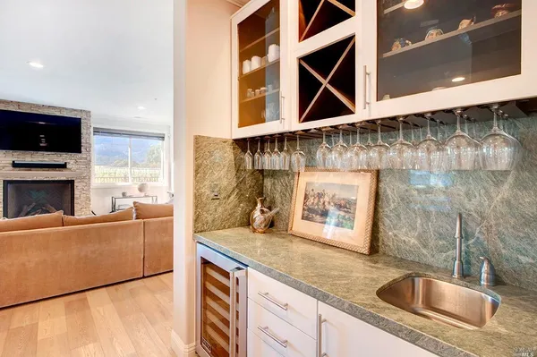 a kitchen with a sink cabinets and a microwave