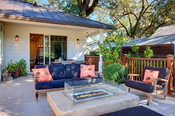 a wooden bench sitting in front of a building