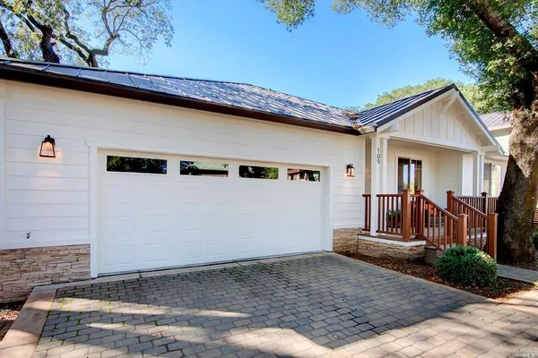 a view of a house with backyard