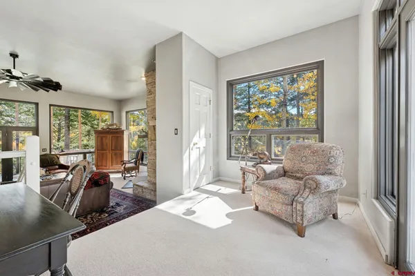 a living room with furniture and a large window