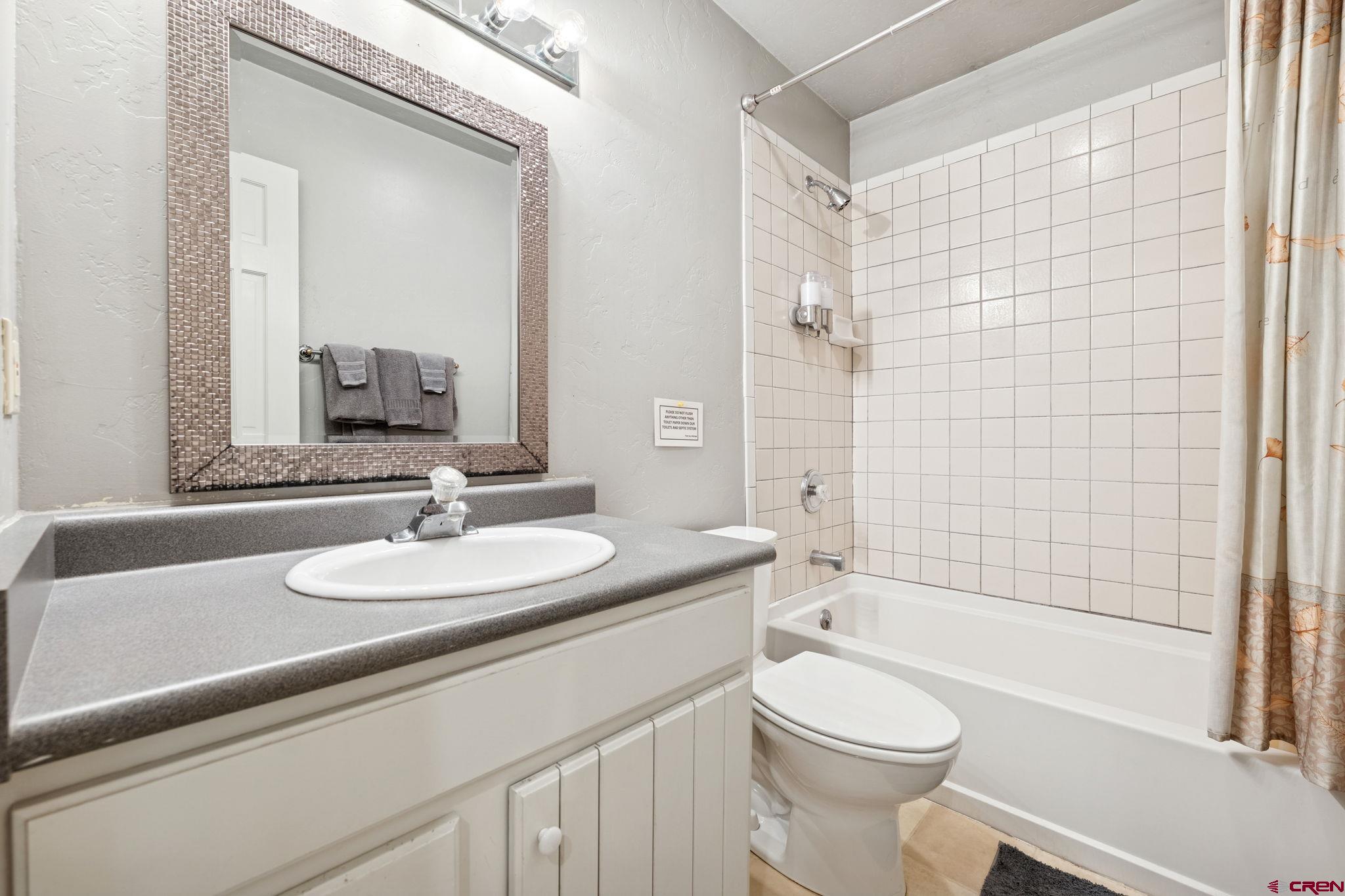 333 Beaver Circle Durango, CO 81301 - Photo 29 of 45 a bathroom with a sink a toilet and shower