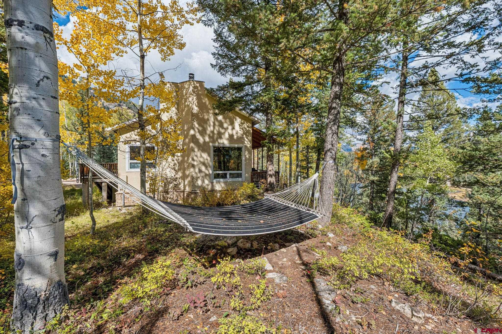 333 Beaver Circle Durango, CO 81301 - Photo 9 of 45 a view of a yard with large trees
