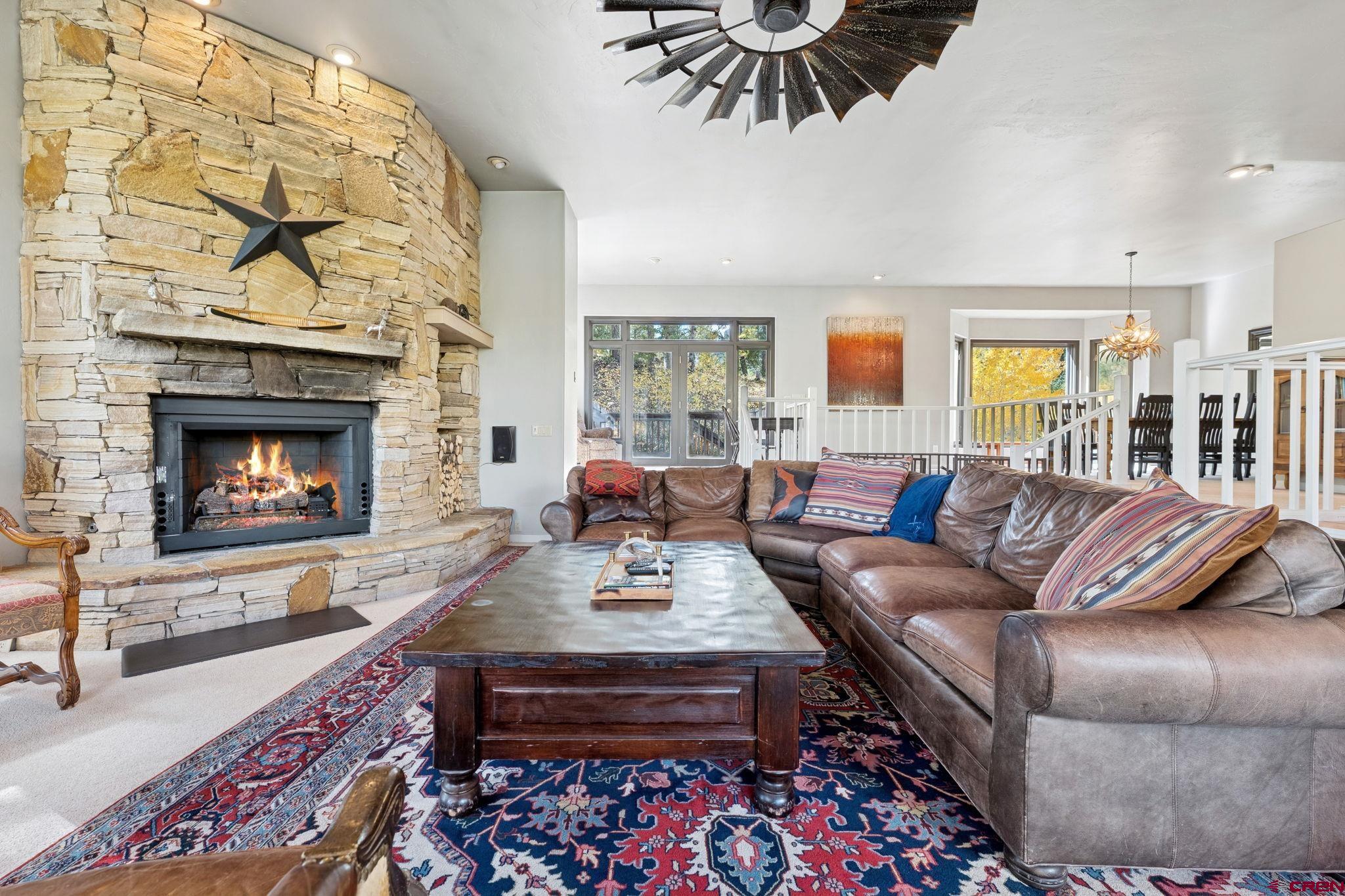 333 Beaver Circle Durango, CO 81301 - Photo 10 of 45 a living room with furniture a flat screen tv and a fireplace