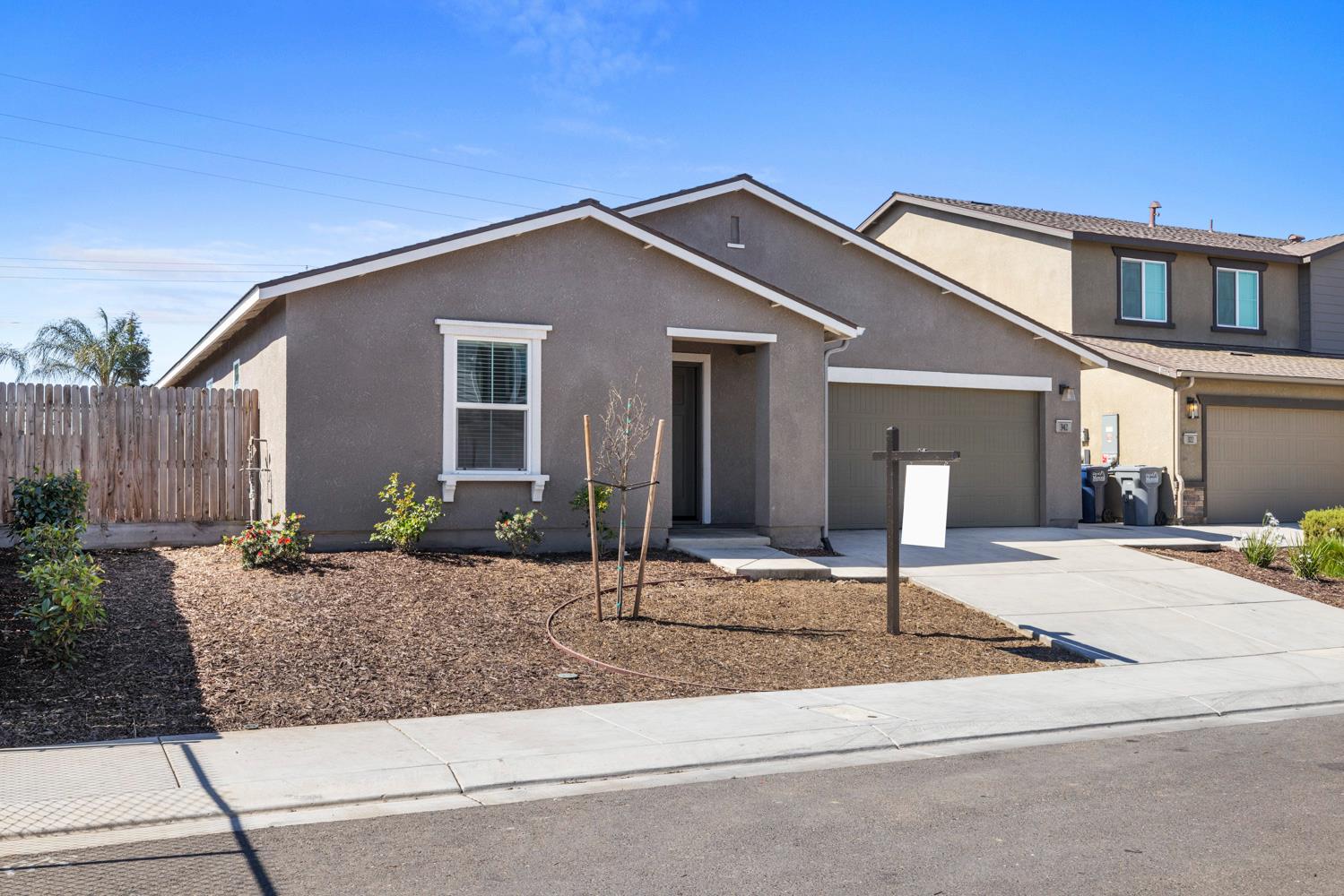 342 Rubicon Court Merced, CA 95341 - Photo 1 of 40 a front view of house with yard and road