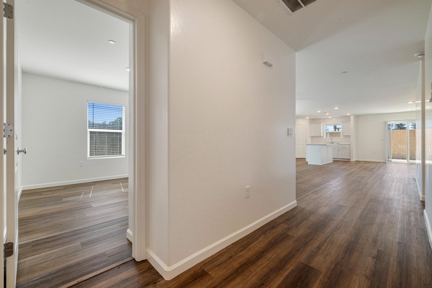 342 Rubicon Court Merced, CA 95341 - Photo 15 of 40 a view of empty room with wooden floor
