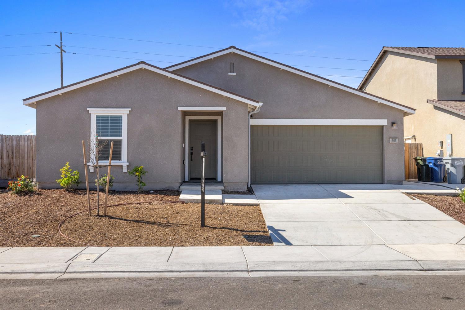 342 Rubicon Court Merced, CA 95341 - Photo 2 of 40 a front view of a house with garage