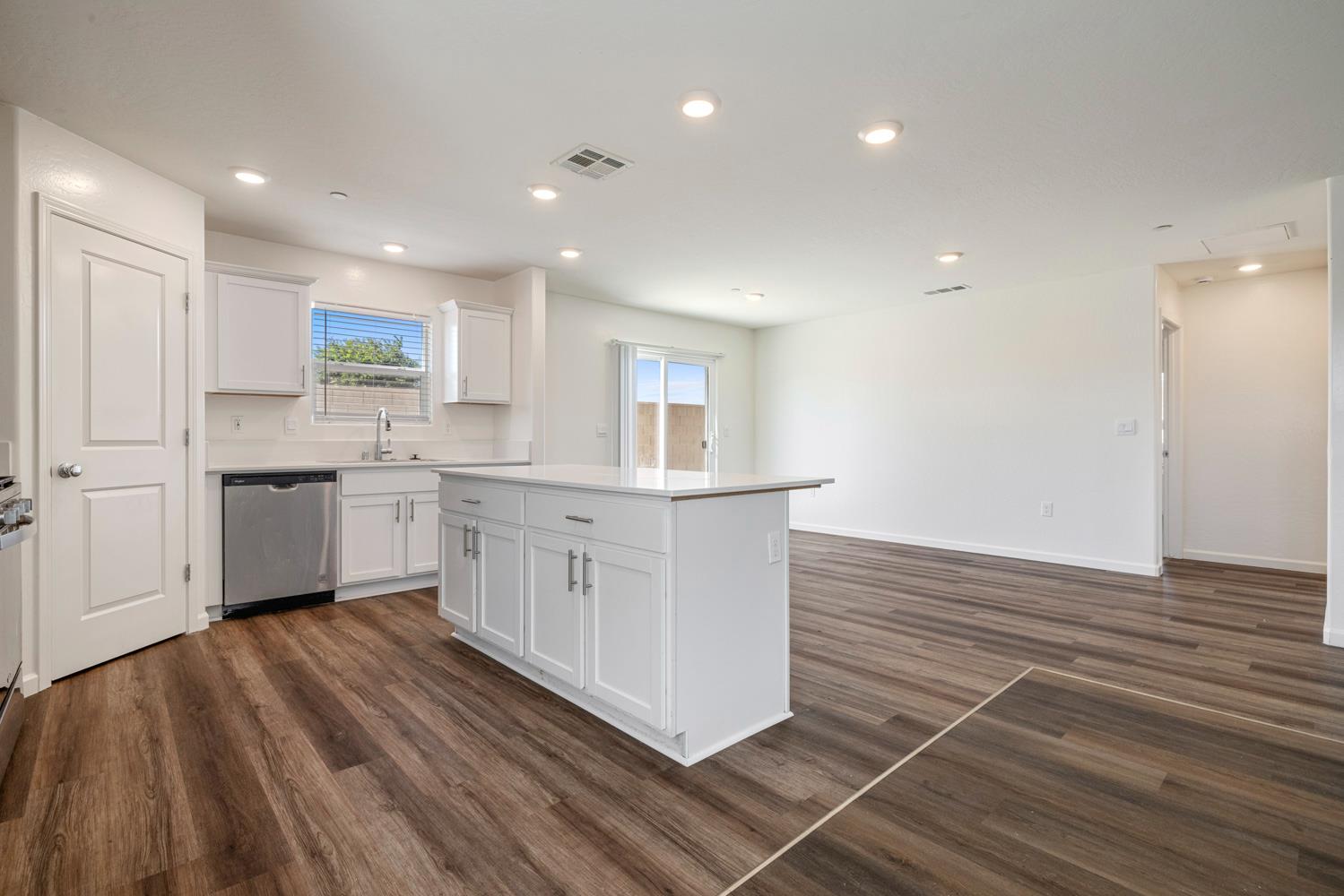 342 Rubicon Court Merced, CA 95341 - Photo 29 of 40 a kitchen with stainless steel appliances a sink cabinets and wooden floor