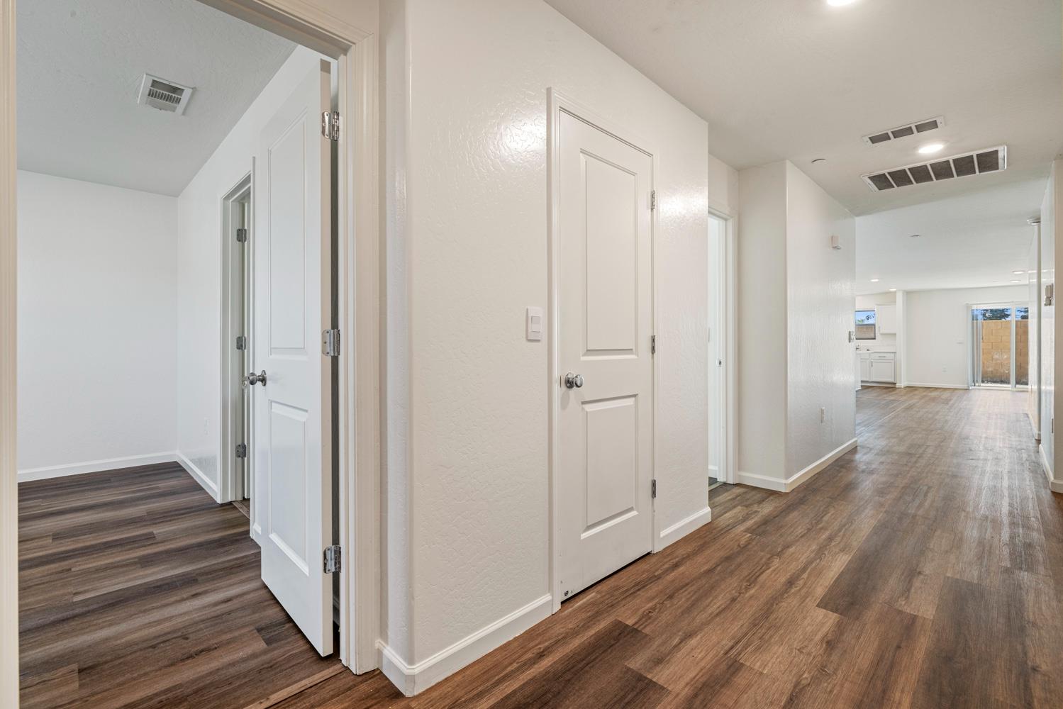 342 Rubicon Court Merced, CA 95341 - Photo 6 of 40 a view of a hallway with wooden floor and staircase