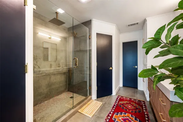 a bedroom with bed and a window