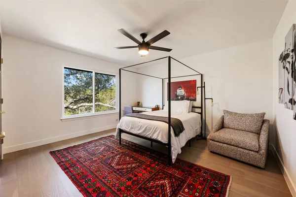 a bathroom with a double vanity sink mirror and toilet
