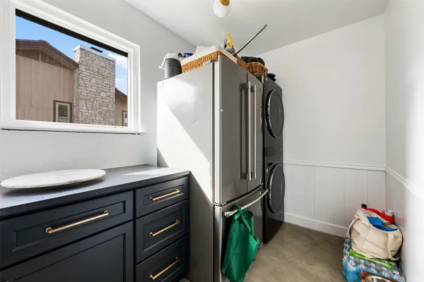 a view of a patio with couches table and chairs and a barbeque
