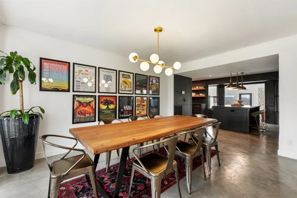 a dining room with furniture and window