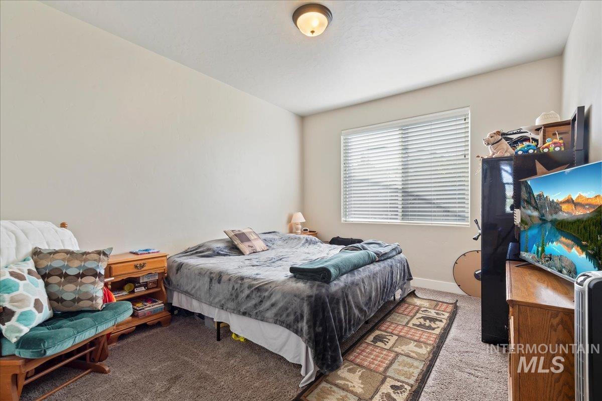 6091 East Path Drive Nampa, ID 83687 - Photo 15 of 33 Bedroom featuring carpet floors and baseboards