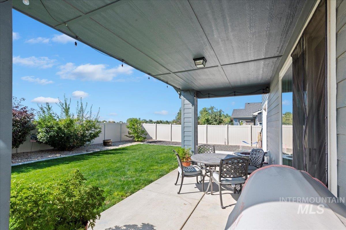 6091 East Path Drive Nampa, ID 83687 - Photo 29 of 33 Fenced backyard featuring a patio area and outdoor dining space