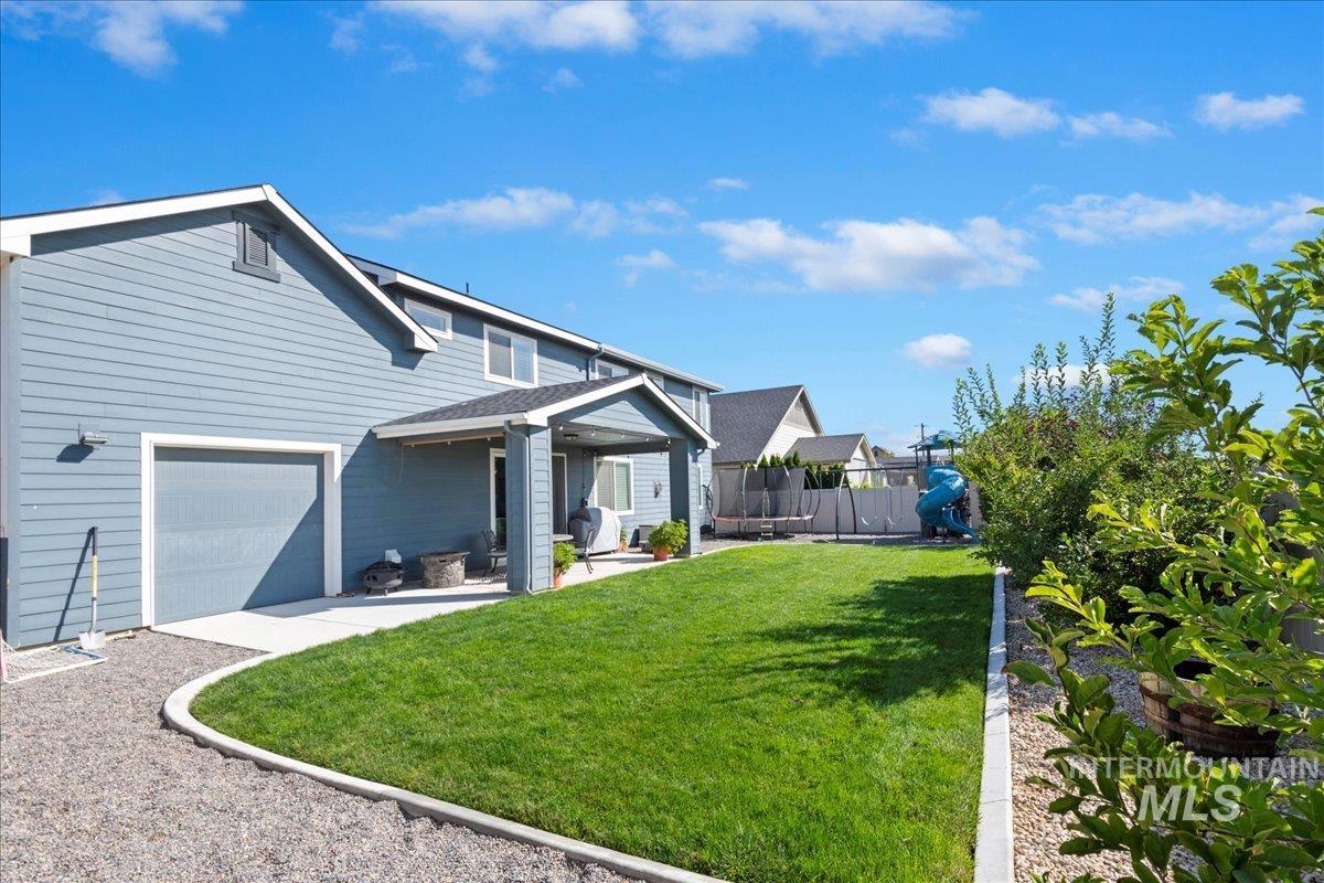 6091 East Path Drive Nampa, ID 83687 - Photo 30 of 33 View of front of home featuring a patio and a garage