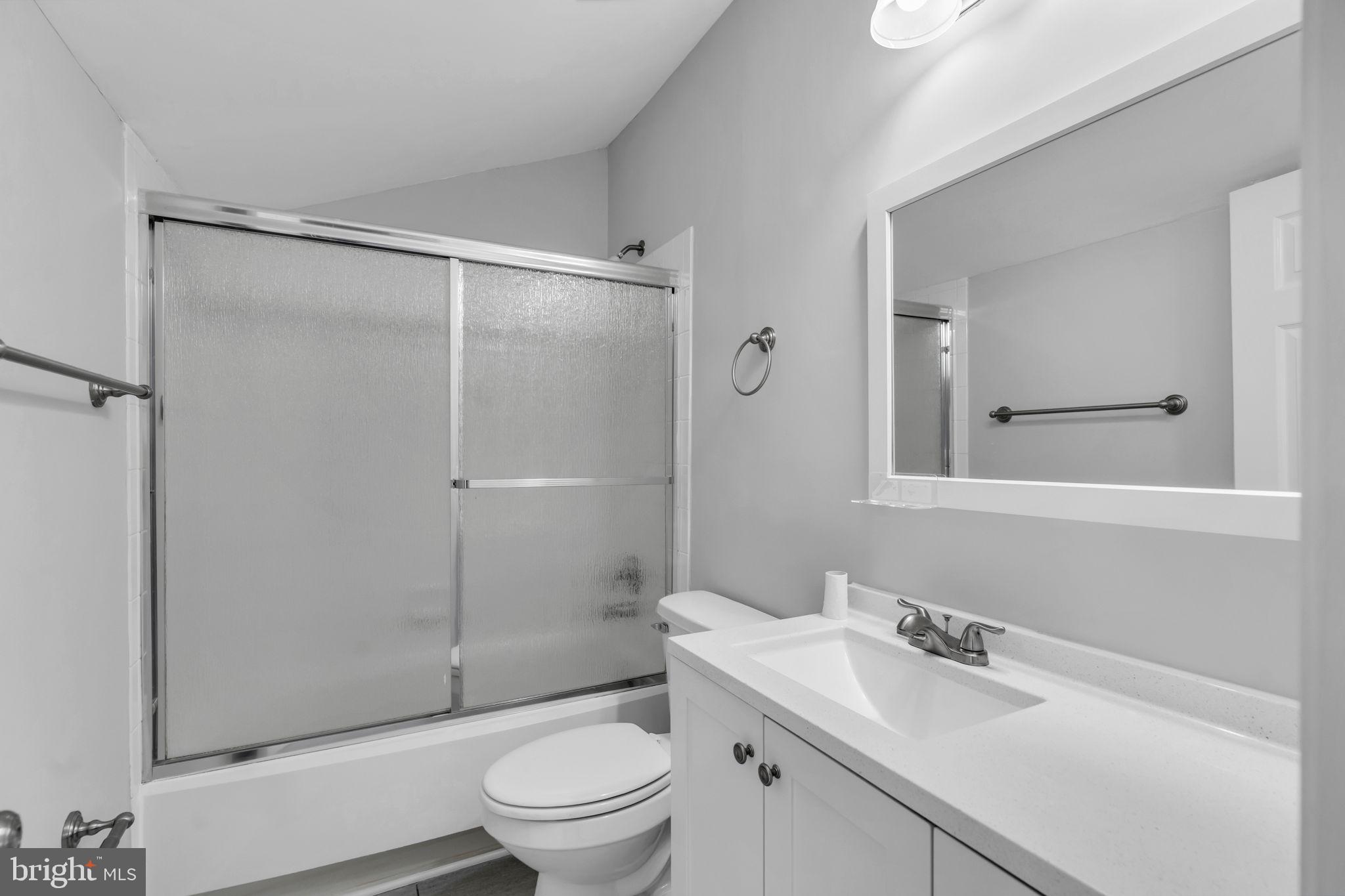 6013 Riddle Walk Alexandria, VA 22312 - Photo 27 of 31 a bathroom with a sink toilet vanity and shower