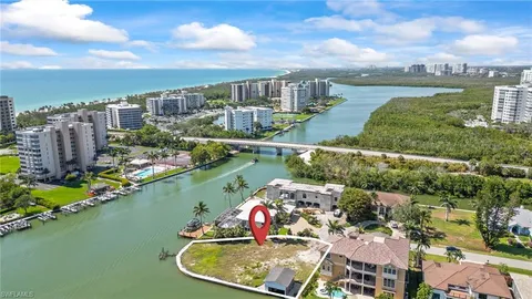 an aerial view of a house with outdoor space lake view and lake view