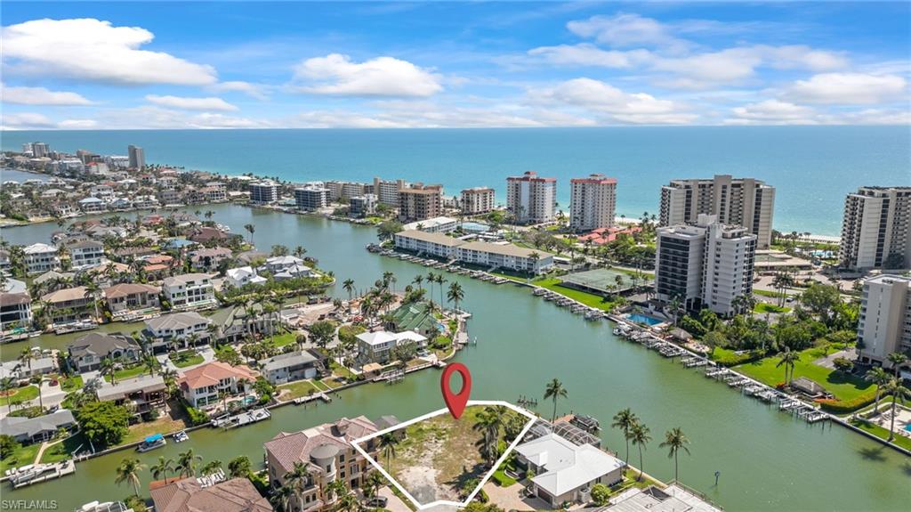140 Flamingo Avenue Naples, FL 34108 - Photo 24 of 25 a view of a city from a lake