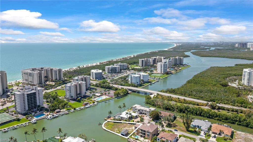 140 Flamingo Avenue Naples, FL 34108 - Photo 3 of 25 a view of a city from a lake