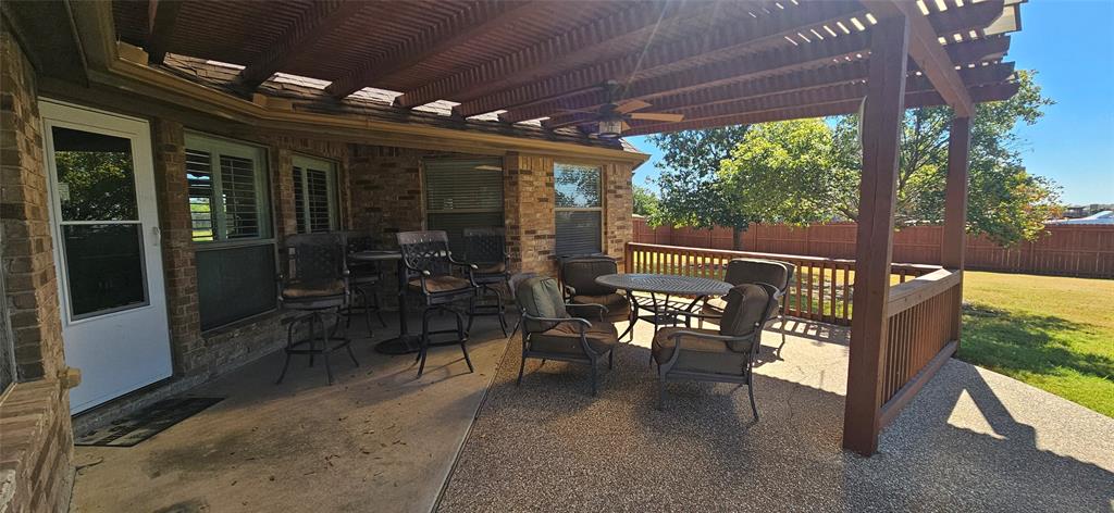 7641 Drew Lane Midlothian, TX 76065 - Photo 11 of 13 a view of a porch with chairs and backyard