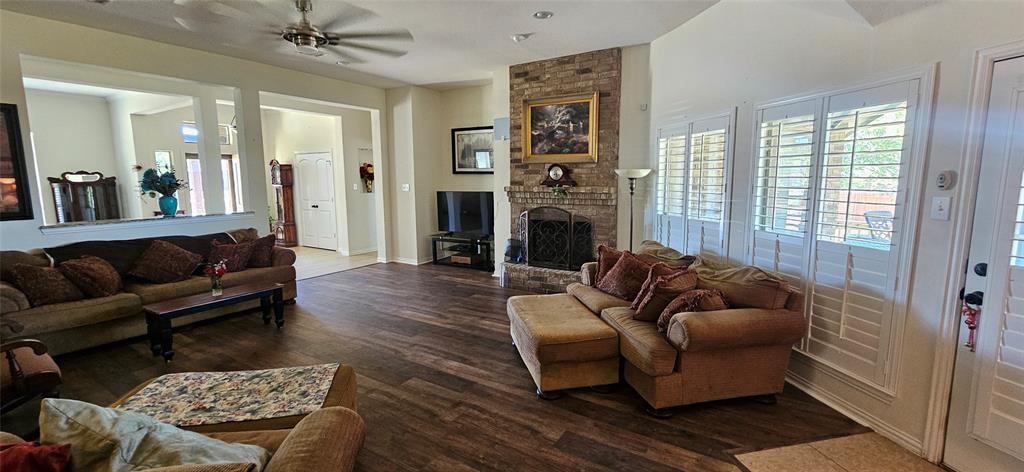 7641 Drew Lane Midlothian, TX 76065 - Photo 4 of 13 a living room with furniture and a fireplace