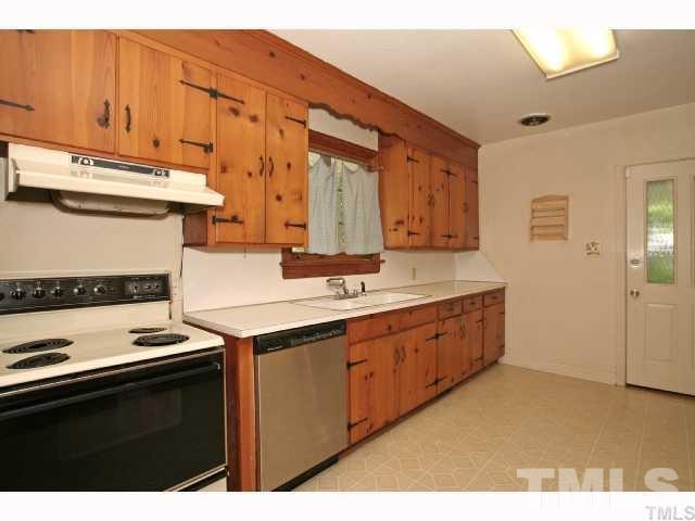 3114 Dixon Road Durham, NC 27707 - Photo 2 of 11 Spacious kitchen that leads to converted garage space and side entry with covered patio.