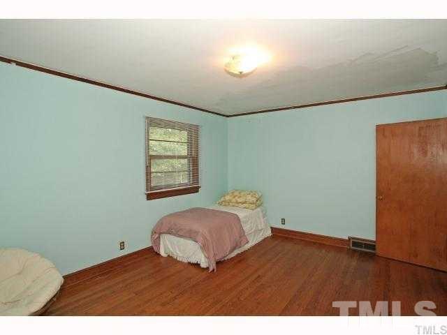 3114 Dixon Road Durham, NC 27707 - Photo 7 of 11 One of two huge bedrooms with hardwoods floors.