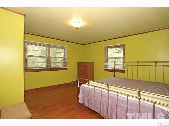 3114 Dixon Road Durham, NC 27707 - Photo 8 of 11 One of two huge bedrooms with hardwoods floors.