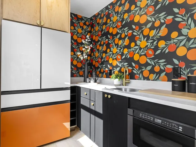 a kitchen with a sink and a refrigerator