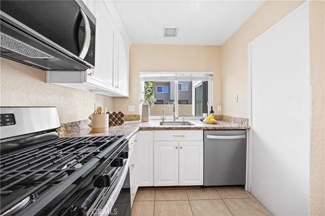 a kitchen with a stove and a sink