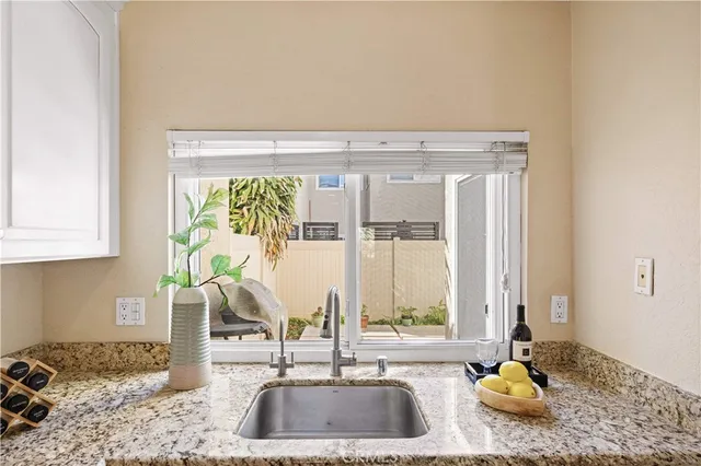 a kitchen with a sink and a window