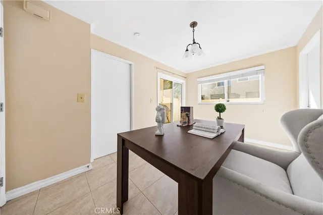 a view of a dining room with furniture and window