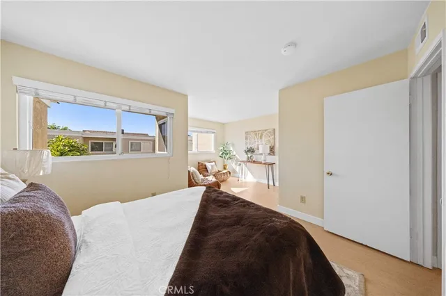 a bed room with a bed and a window